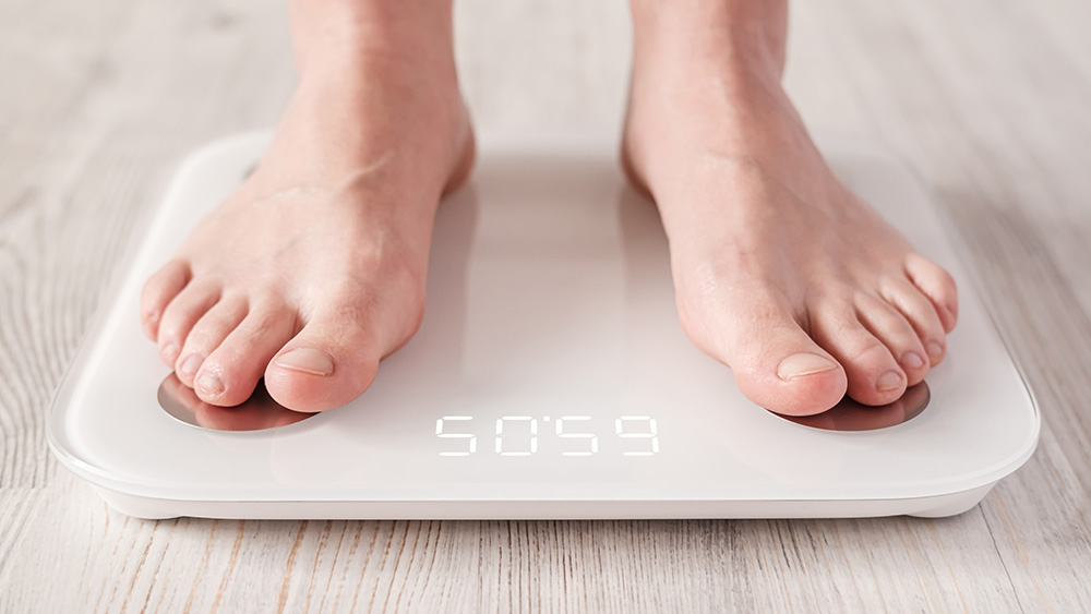 Bare feet stand on smart scales