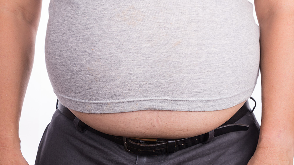 Man on t-shirt with protruded big belly
