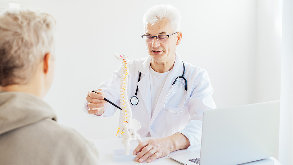 Doctor explaining about Osteoporosis treatments